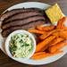 Smokehouse 52's beef brisket dinner with sweet potato fries, coleslaw and Jiffy cornbread.
Courtney Sacco I AnnArbor.com